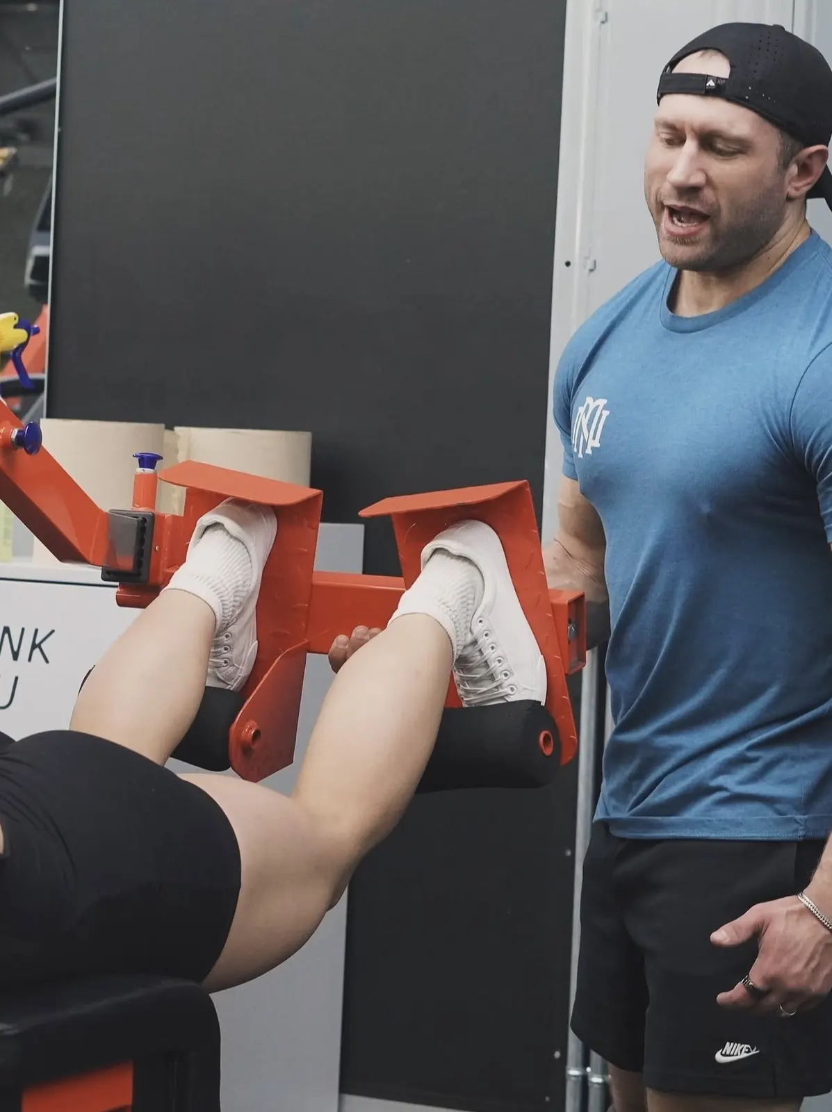 David DeMesquita coaching a client in the gym