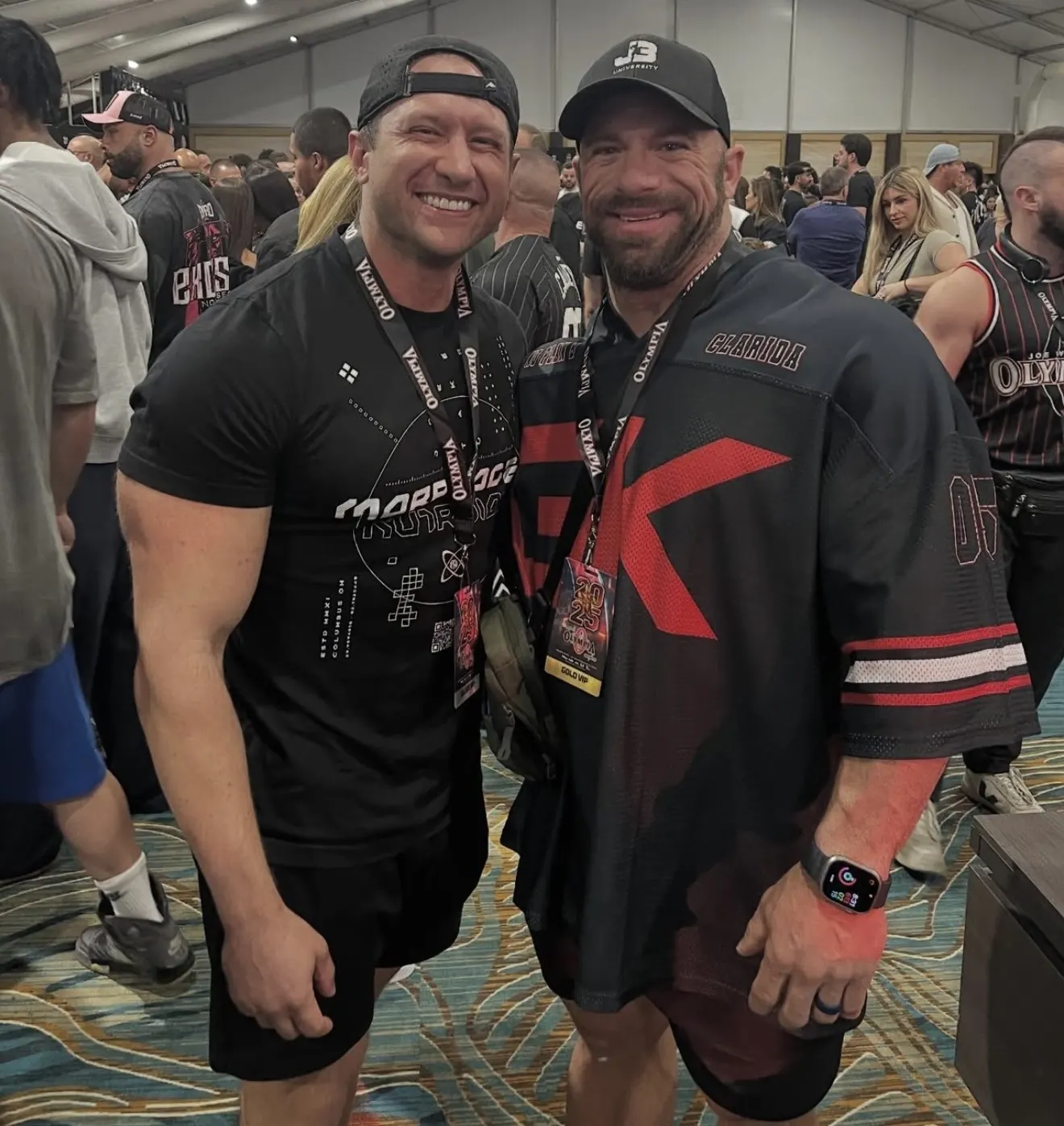 David DeMesquita at an expo with a fellow coach